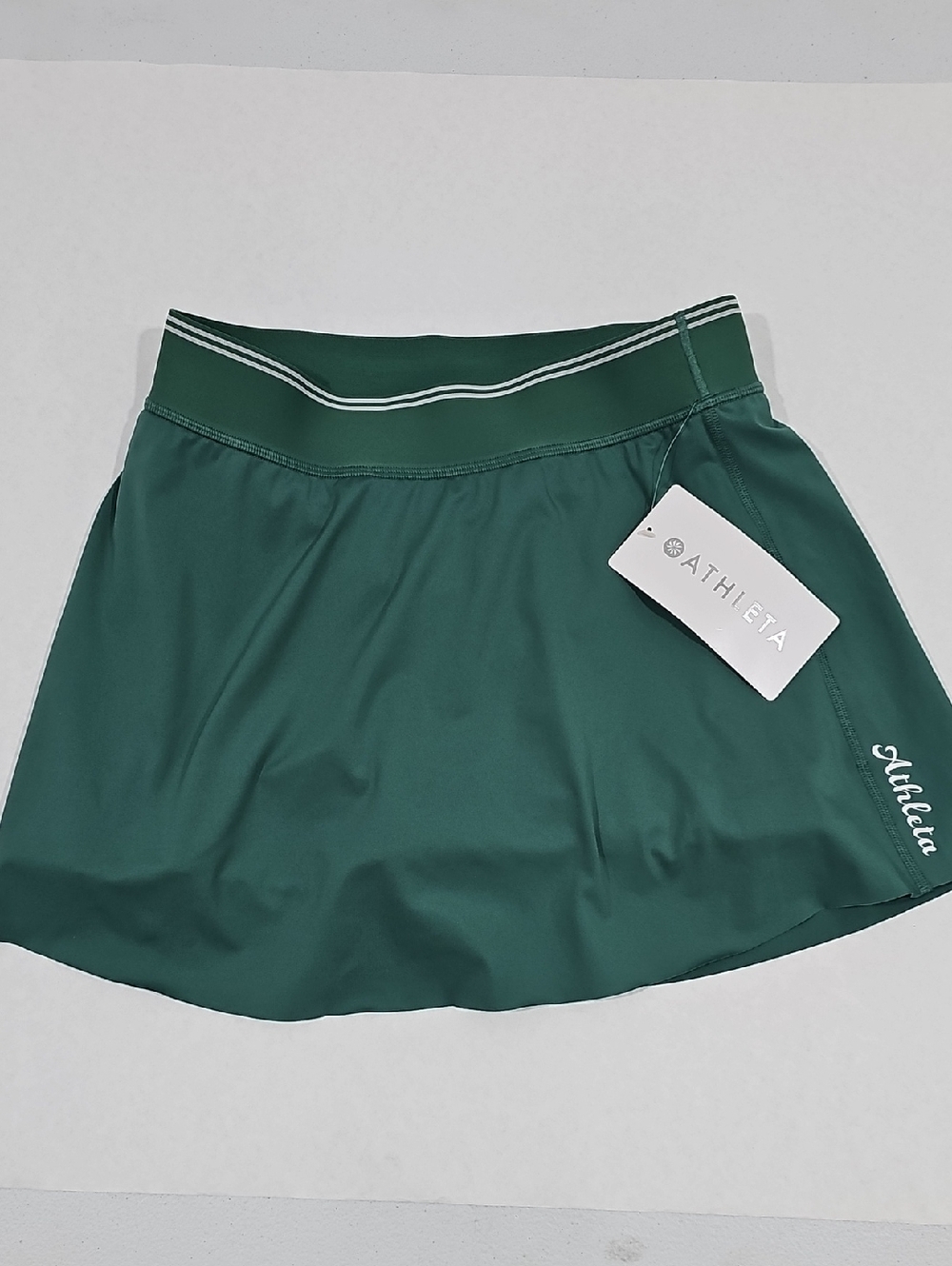 #25.   Athleta Dark Green Athletic Skort with Contrast Waistband